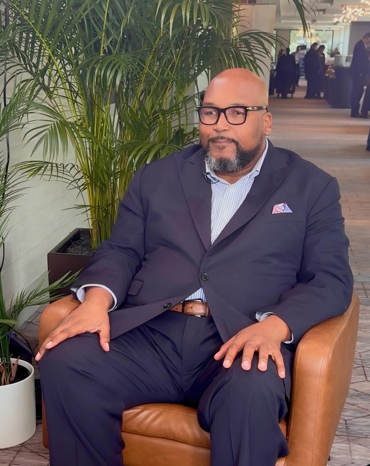 Bishop Kelvin L. Cobaris seated for an interview